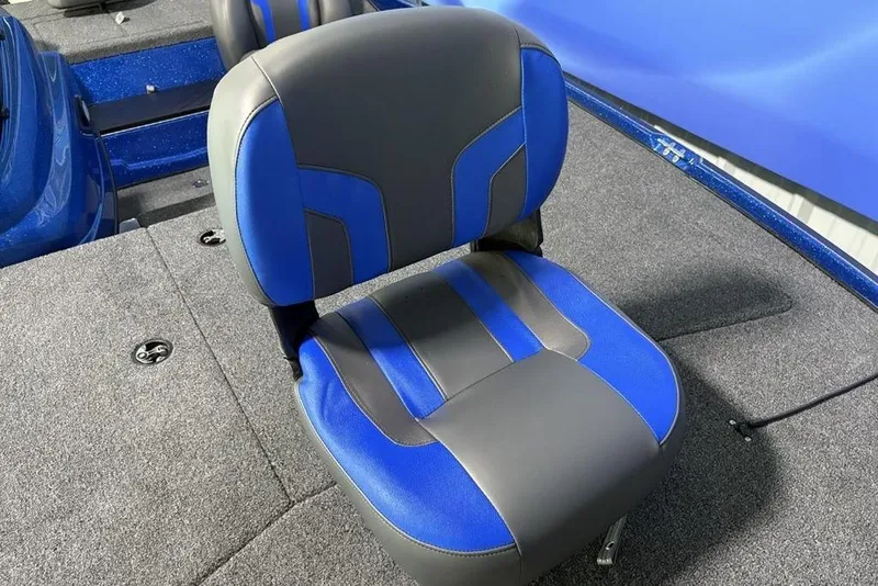 Slide: The Image of 2026 Nitro Z17 boat seat with blue and gray upholstery on a carpeted deck. - 4