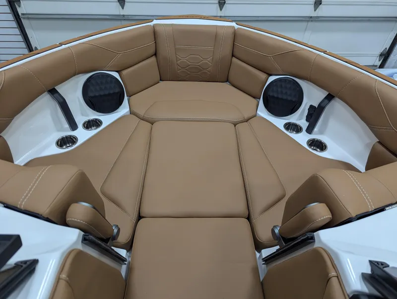 Slide: The Image of 2026 Malibu 23 LSV boat interior with tan leather seats and modern dashboard. - 18