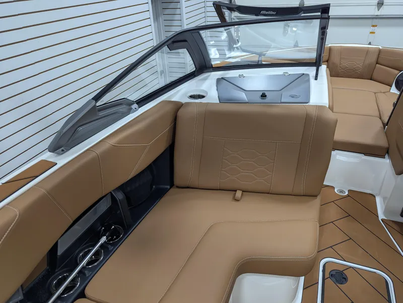 Slide: The Image of Luxurious interior of 2026 Malibu 23 LSV boat with tan leather seating. - 20
