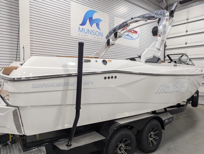 Slide: The Image of 2026 Malibu Wakesetter 23 LSV boat displayed in a modern showroom. - 3