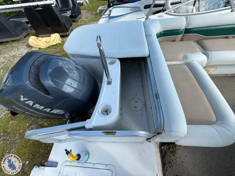 Slide: The Image of 2005 Hurricane FunDeck 226 REF boat with Yamaha outboard motor, featuring spacious seating. - 12