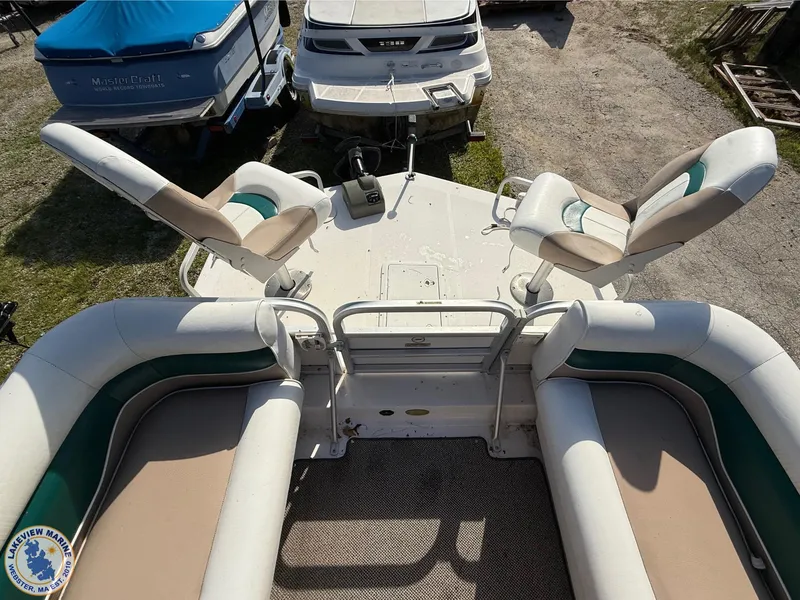 Slide: The Image of 2005 Hurricane FunDeck 226 REF boat interior with seating and control panel. - 4