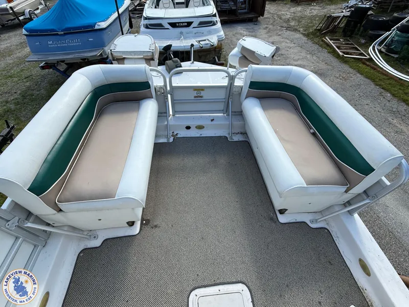 Slide: The Image of 2005 Hurricane FunDeck 226 REF boat interior with seating and carpeted floor. - 5