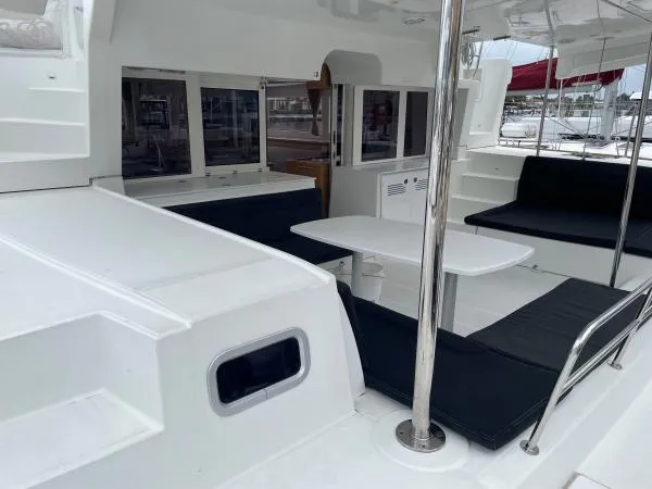 Slide: The Image of Spacious deck area of 2018 Lagoon 450 F catamaran with seating and table. - 11