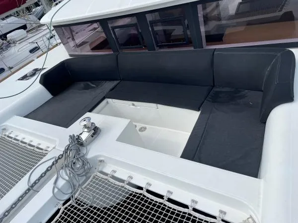 Slide: The Image of Luxurious seating area on a 2018 Lagoon 450 F catamaran deck. - 16