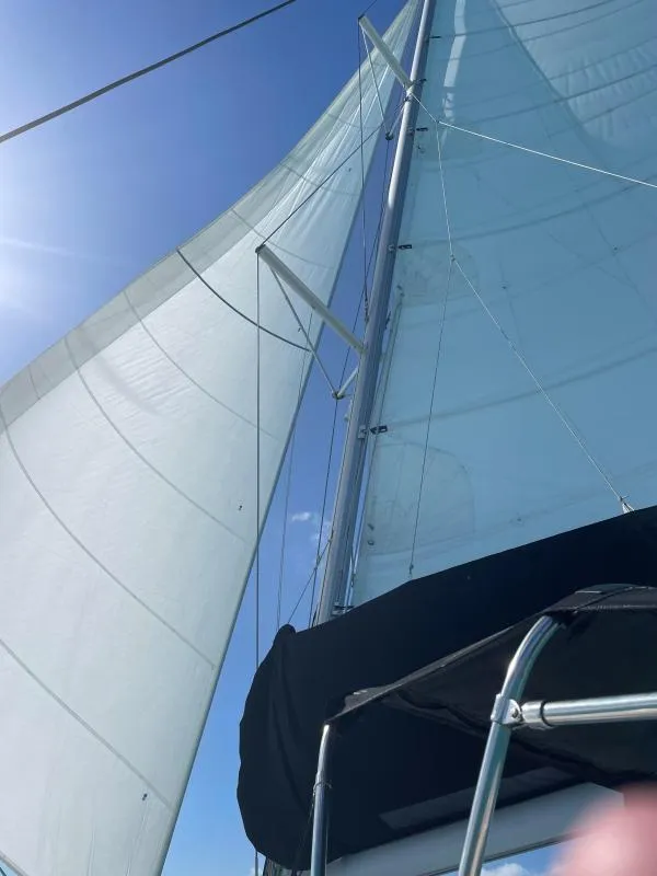 Slide: The Image of Sailing yacht Lagoon 450 F, 2018 model, with sails unfurled against a clear blue sky. - 17
