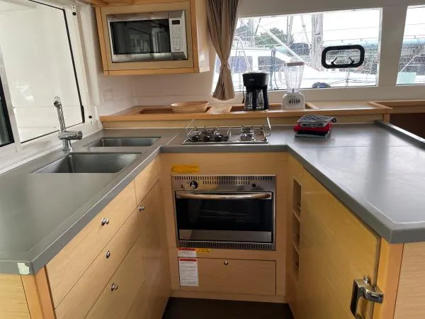 Slide: The Image of Modern kitchen in 2018 Lagoon 450 F yacht with appliances and sleek cabinetry. - 5