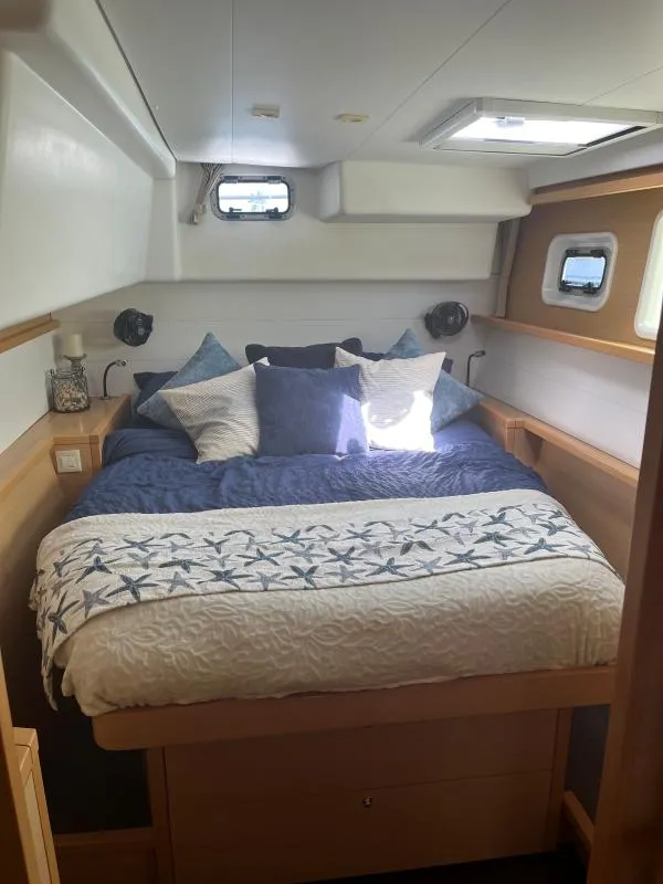 Slide: The Image of Luxurious cabin interior of 2018 Lagoon 450 F yacht with cozy bedding. - 8