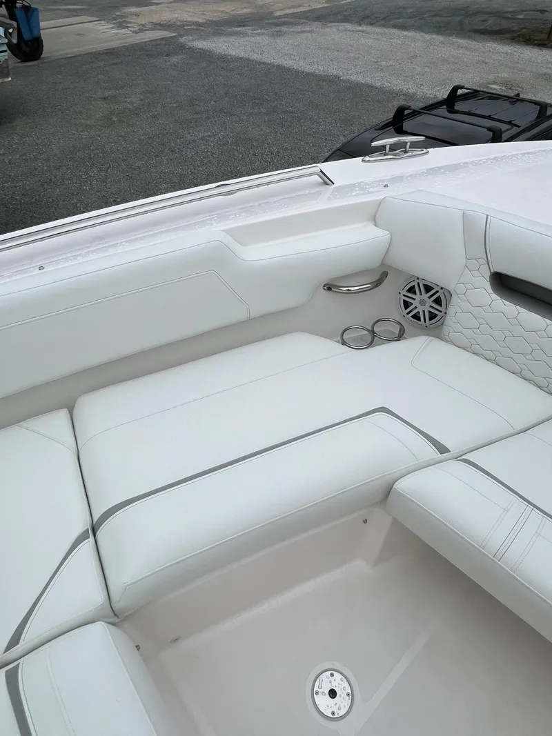 Slide: The Image of 2026 Tiara Yachts 34 LS interior with white seating and cup holders. - 10