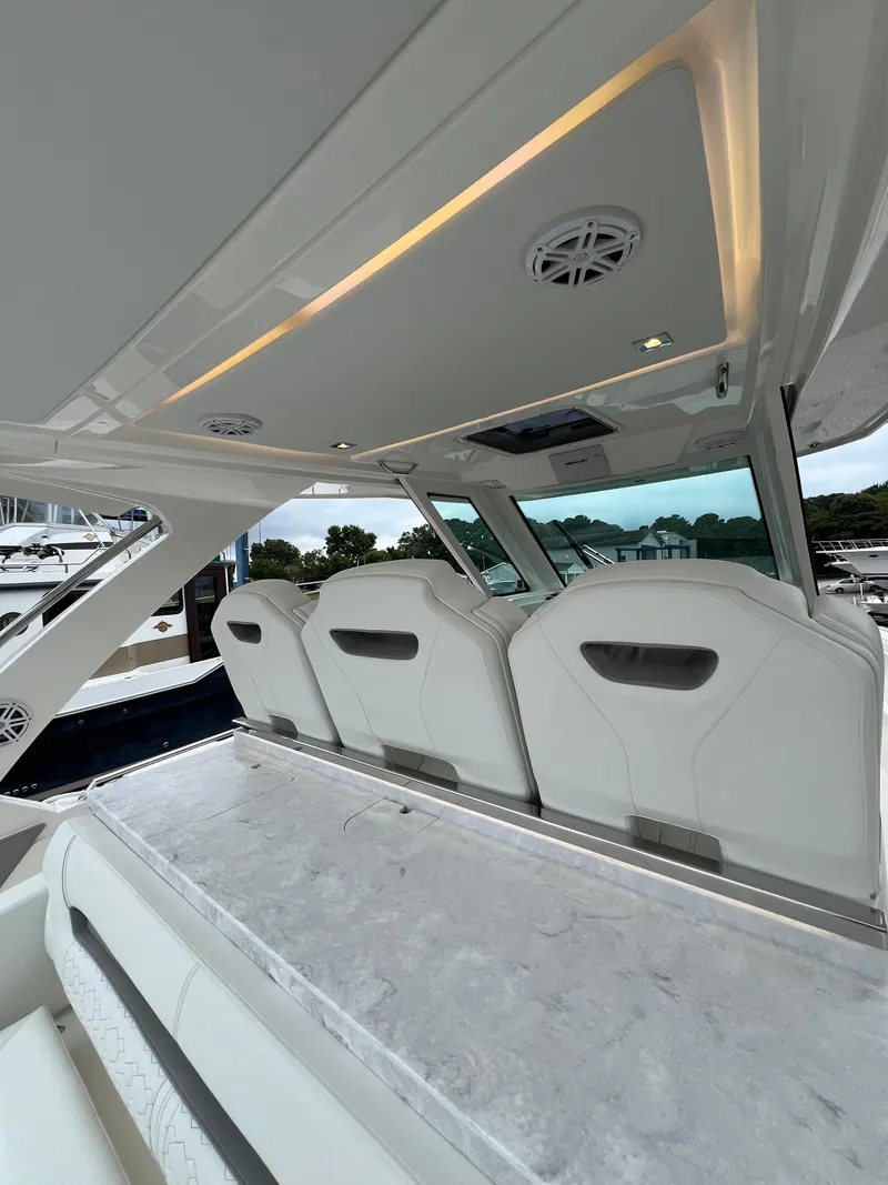 Slide: The Image of 2026 Tiara Yachts 34 LS interior with sleek seating and modern design. - 8