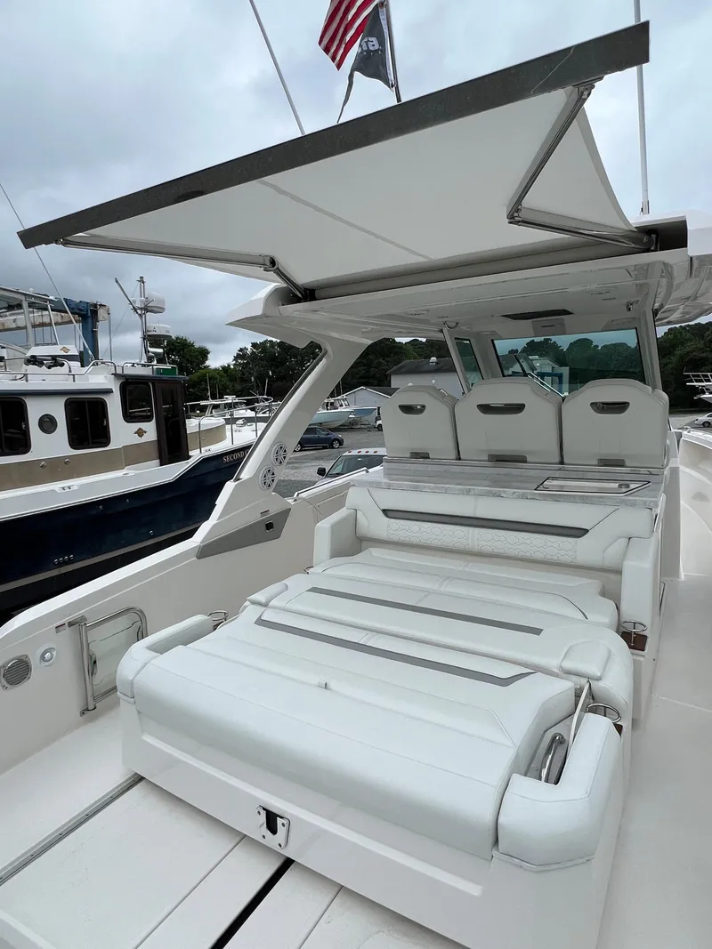 Slide: The Image of 2026 Tiara Yachts 34 LS luxury boat with spacious seating and sleek design. - 9