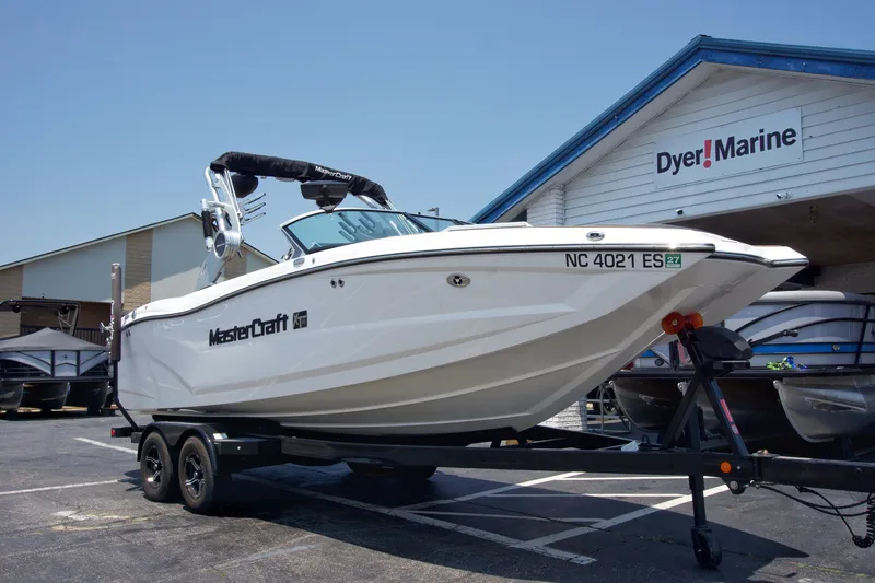 Slide: The Image of 2021 MasterCraft XT22 boat on trailer at Dyer Marine dealership. - 8