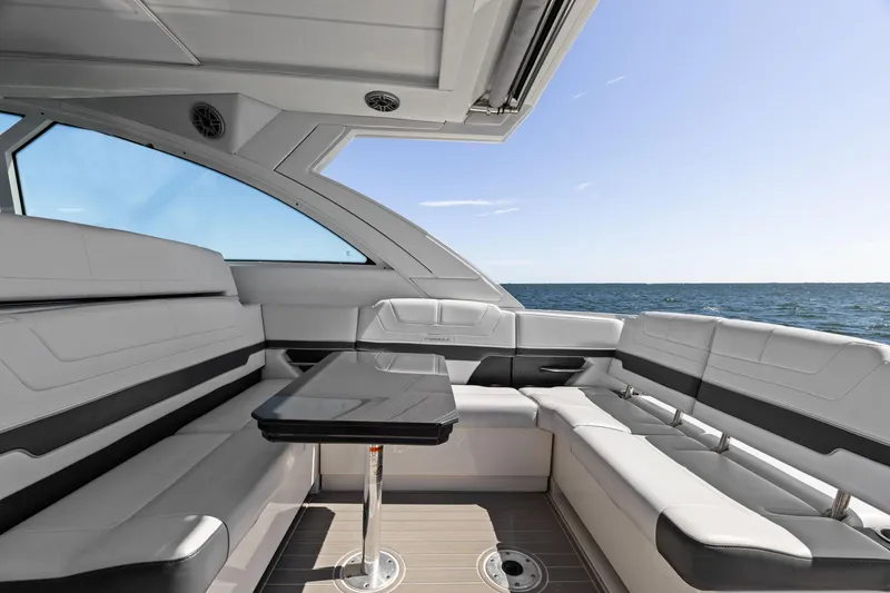 Slide: The Image of 2023 Formula 380 Super Sport Crossover OB interior with luxurious seating and ocean view. - 14