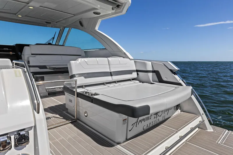 Slide: The Image of 2023 Formula 380 Super Sport Crossover OB yacht with luxurious seating on open water. - 17