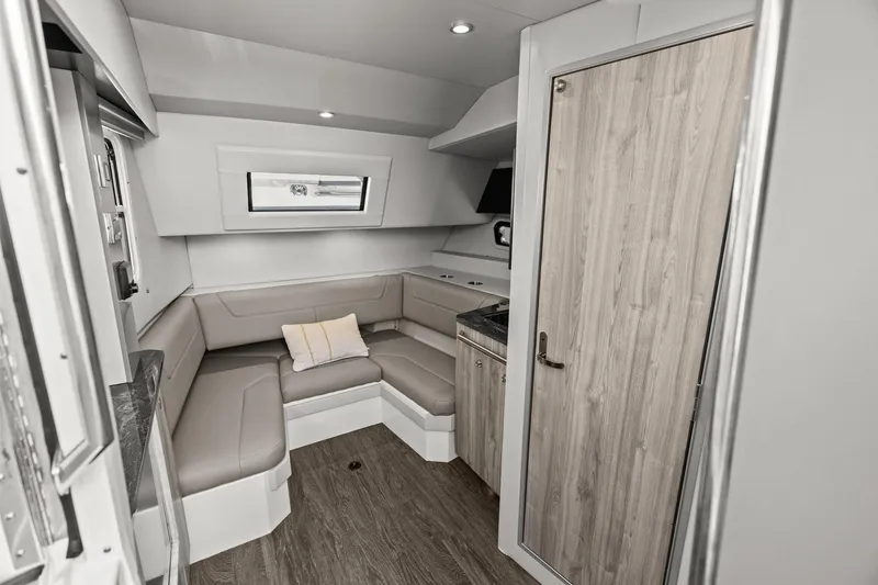 Slide: The Image of 2023 Formula 380 Super Sport Crossover OB interior with modern seating and wood accents. - 21