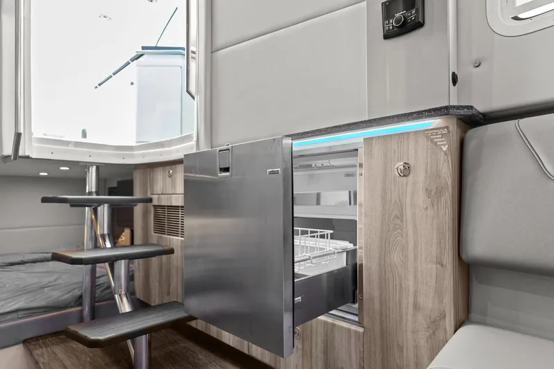 Slide: The Image of 2023 Formula 380 Super Sport Crossover OB interior with modern cabinetry and open drawer. - 26