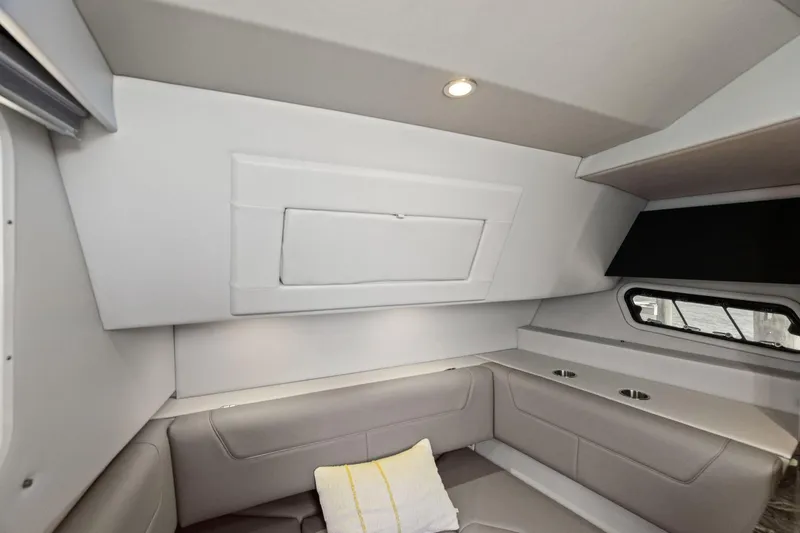 Slide: The Image of 2023 Formula 380 Super Sport Crossover OB cabin interior with modern seating and window. - 31