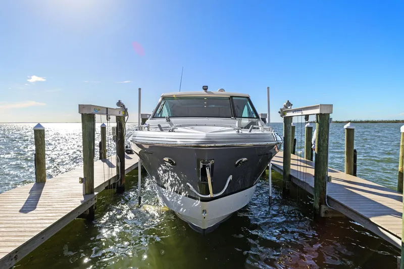 Slide: The Image of 2023 Formula 380 Super Sport Crossover OB docked on sunny waterfront. - 32