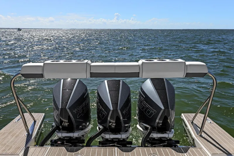 Slide: The Image of 2023 Formula 380 Super Sport Crossover OB with triple outboard engines on open water. - 35