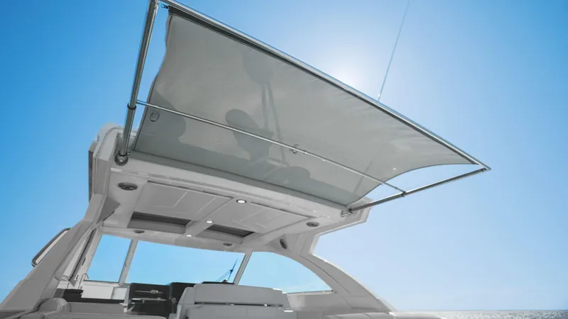 Slide: The Image of 2023 Formula 380 Super Sport Crossover OB with sunshade under clear blue sky. - 36