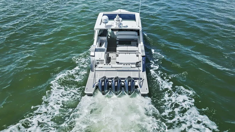 Slide: The Image of 2023 Formula 380 Super Sport Crossover OB cruising on open water. - 38