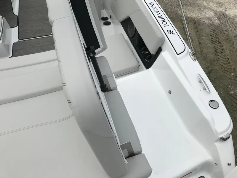 Slide: The Image of 2026 Four Winns H-1 FREEDOM boat interior with white seating and sleek design. - 15