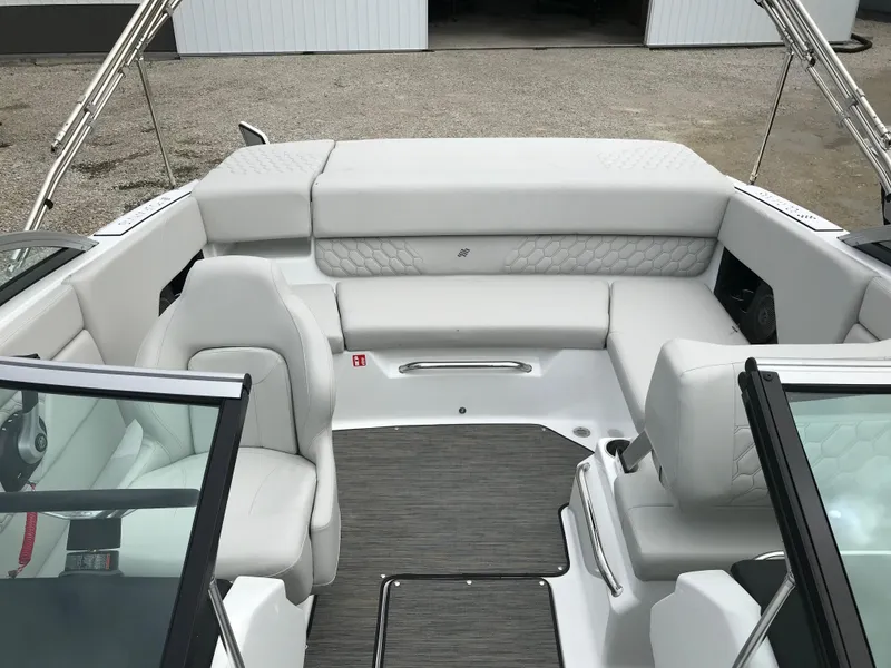 Slide: The Image of 2026 Four Winns H-1 FREEDOM boat interior with white seating and modern design. - 18