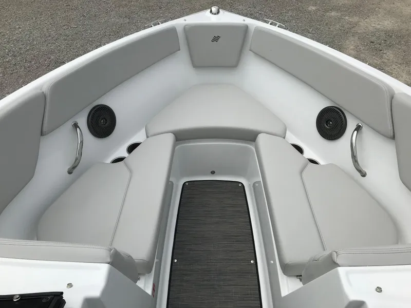 Slide: The Image of 2026 Four Winns H-1 FREEDOM boat interior with gray seating and speakers. - 19