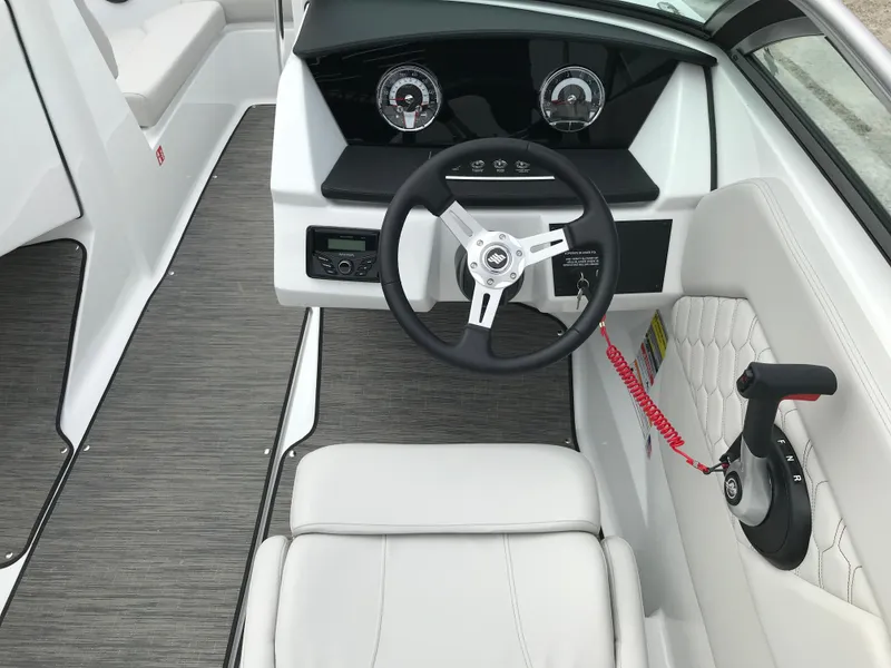 Slide: The Image of 2026 Four Winns H-1 FREEDOM boat interior with steering wheel and control panel. - 22