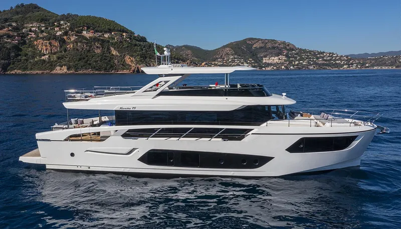 The Image of Luxury yacht Absolute NAVETTA 75, 2026 model, cruising near scenic coastal landscape. - 0