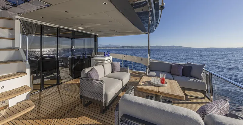 Slide: The Image of Luxurious deck of 2026 Absolute NAVETTA 75 yacht with ocean view and elegant seating. - 14