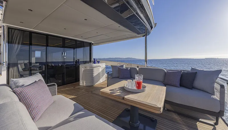 Slide: The Image of Luxurious deck of 2026 Absolute NAVETTA 75 yacht with ocean view and elegant seating. - 15