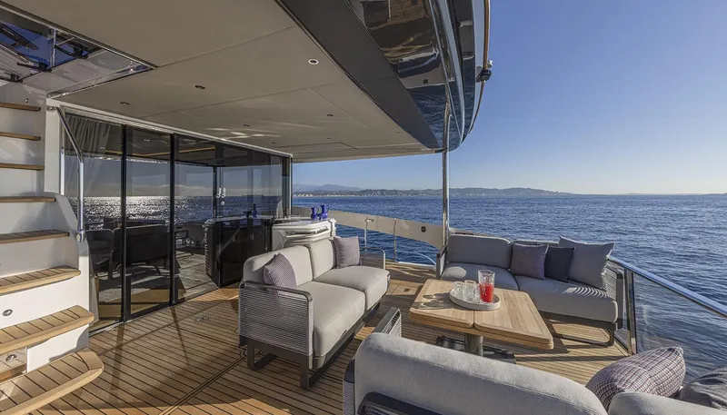 Slide: The Image of Luxurious Absolute NAVETTA 75 yacht deck with elegant seating, ocean view, and modern design, 2026 model. - 16