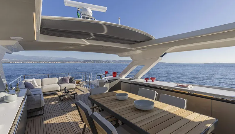 Slide: The Image of Luxurious 2026 Absolute NAVETTA 75 yacht deck with elegant seating and ocean view. - 19
