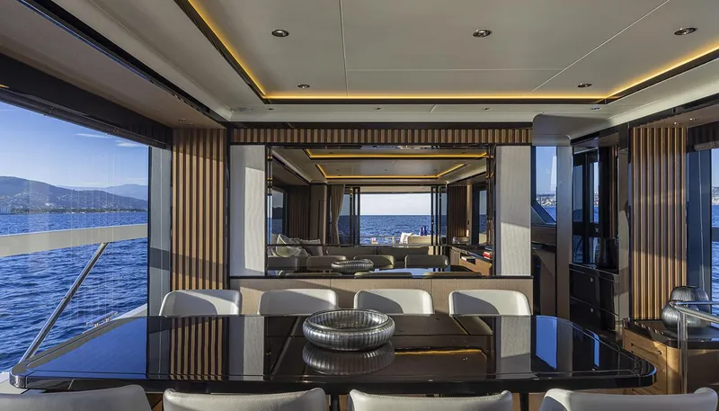 Slide: The Image of Luxurious interior of 2026 Absolute NAVETTA 75 yacht with ocean view and elegant dining area. - 24