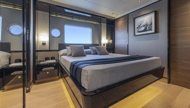 Slide: The Image of Luxurious bedroom interior on Absolute NAVETTA 75 yacht, featuring modern design and elegant decor, 2026 model. - 28
