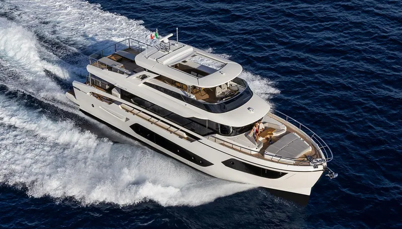 Slide: The Image of Luxury Absolute NAVETTA 75 yacht cruising on open sea, 2026 model. - 3
