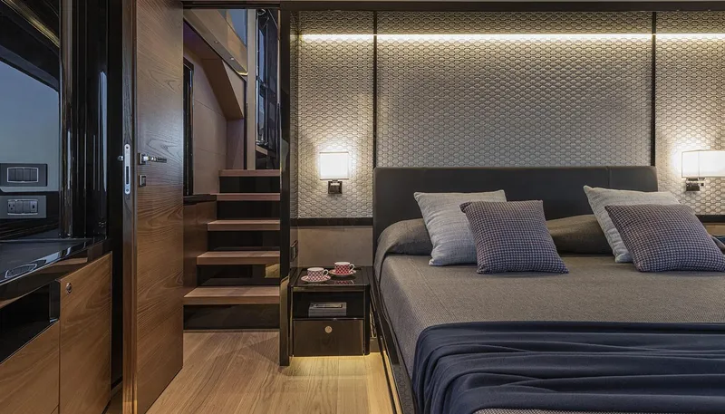 Slide: The Image of Luxurious bedroom interior of Absolute NAVETTA 75 yacht, featuring modern design and elegant lighting, 2026 model. - 32
