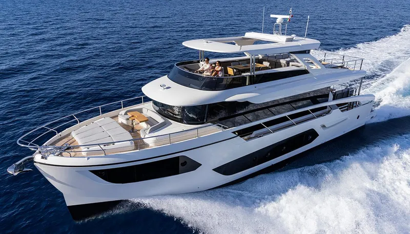 Slide: The Image of Luxurious 2026 Absolute NAVETTA 75 yacht cruising on open sea. - 5