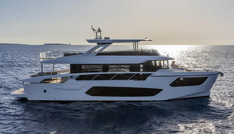 Slide: The Image of Luxury Absolute NAVETTA 75 yacht cruising on open sea, 2026 model. - 1