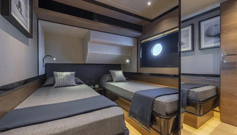 Slide: The Image of Luxurious twin cabin interior of Absolute NAVETTA 75 yacht, 2026 model, featuring modern design. - 34