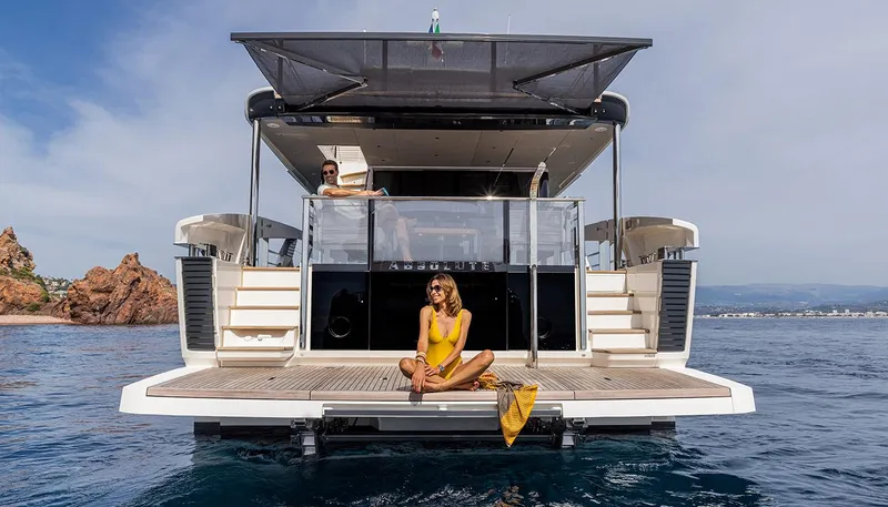 Slide: The Image of Luxury Absolute NAVETTA 75 yacht, 2026 model, with people relaxing on the deck. - 8