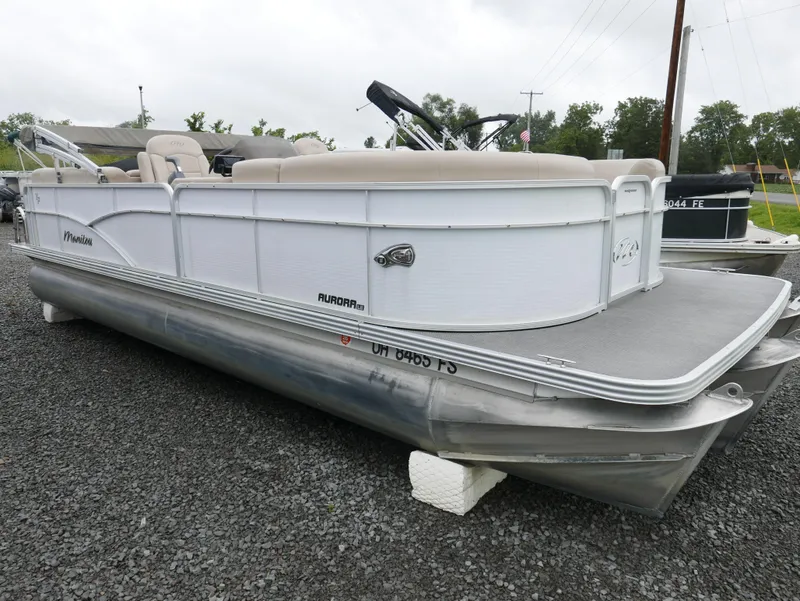 The Image of 2017 Manitou Aurora VP pontoon boat on gravel lot, side view. - 0