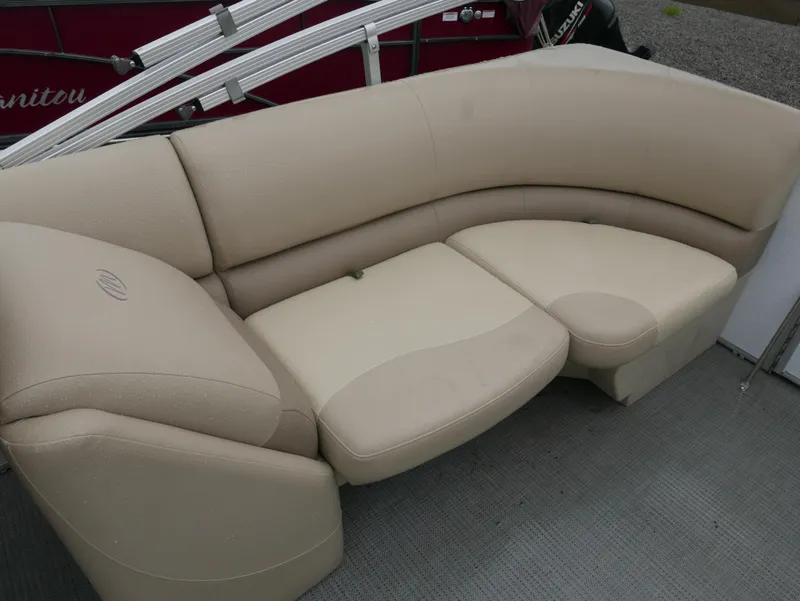 Slide: The Image of Beige seating on 2017 Manitou Aurora VP pontoon boat, featuring curved design and comfortable upholstery. - 15