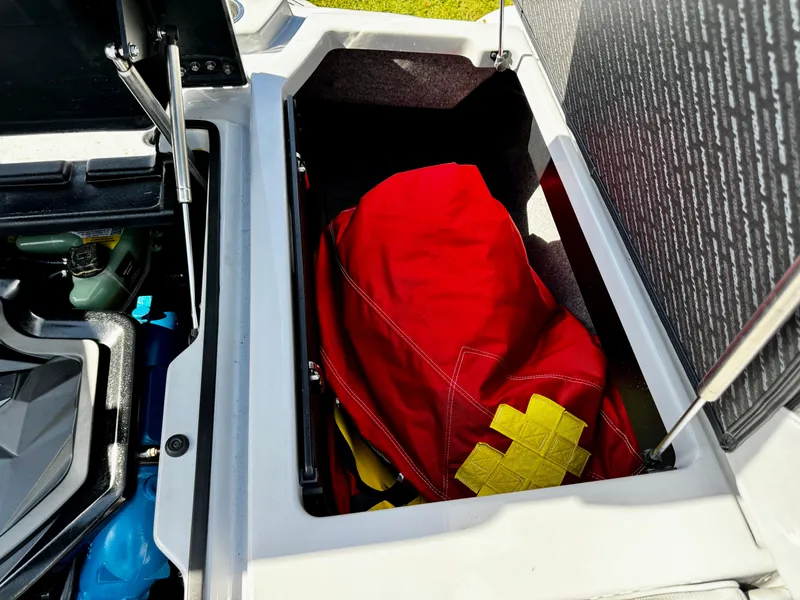 Slide: The Image of Open storage compartment in 2020 Nautique Super Air Nautique G25 Coastal Edition boat. - 12