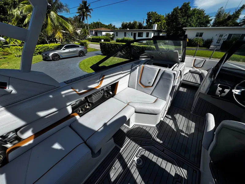 Slide: The Image of 2020 Nautique Super Air Nautique G25 Coastal Edition interior with luxurious seating and modern design. - 15