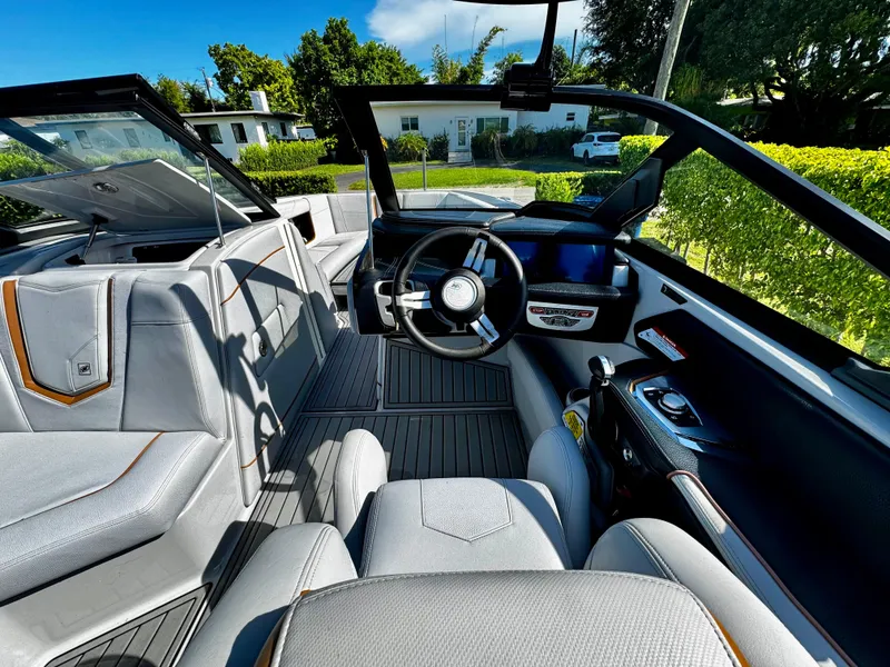Slide: The Image of 2020 Nautique Super Air Nautique G25 Coastal Edition interior with sleek design and modern controls. - 18