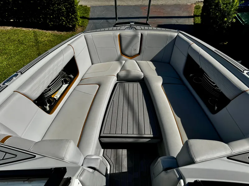Slide: The Image of 2020 Nautique Super Air Nautique G25 Coastal Edition interior with luxurious seating and sleek design. - 22