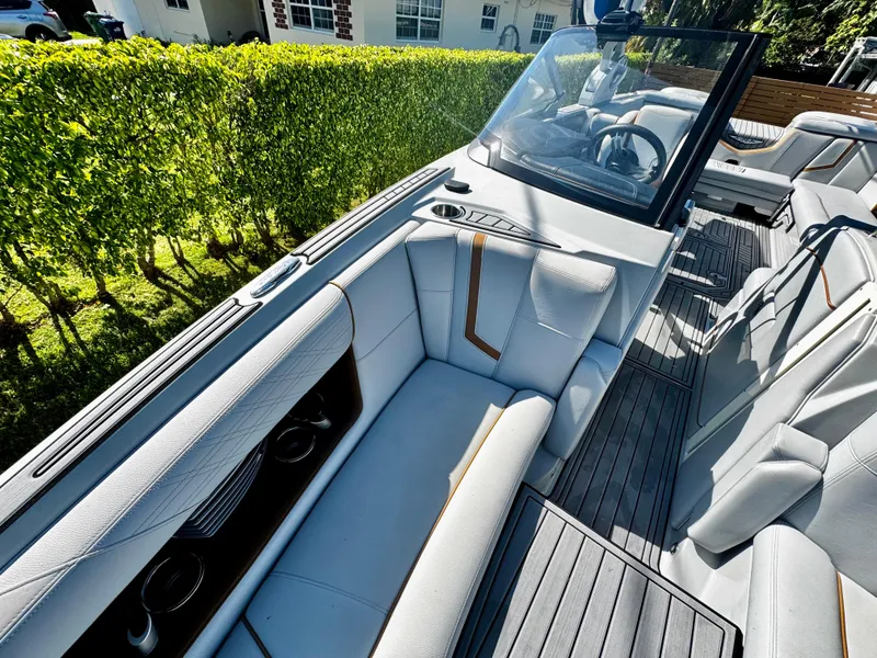 Slide: The Image of 2020 Nautique Super Air Nautique G25 Coastal Edition interior with luxurious seating and sleek design. - 24