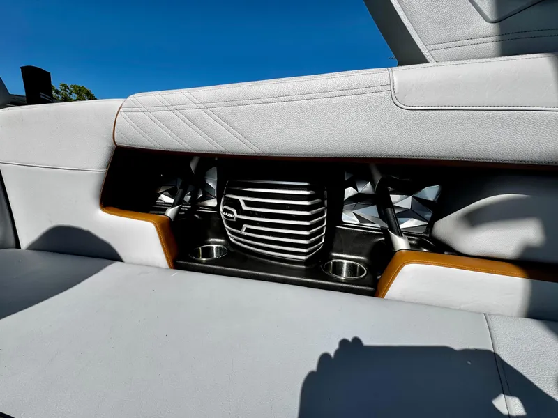 Slide: The Image of 2020 Nautique Super Air Nautique G25 Coastal Edition interior with sleek seating and cup holders. - 26